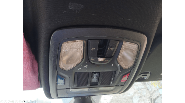 overhead console truck showing where the help emergency roadside assistance buttons are located and where the lamp light call for help push to talk sunglass holder is found between the two sun visors drivers and passengers side in the m