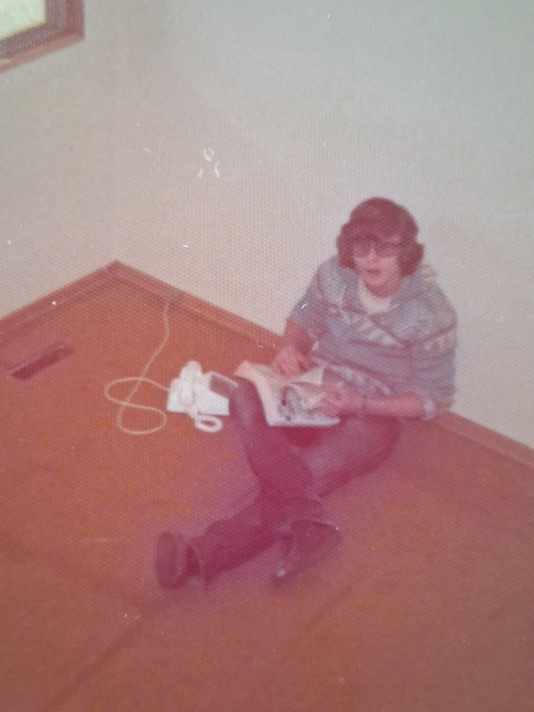 Jenn's Dad Harold Nyhof and the year is 1977 and that's a telephone and a phone book in the picture